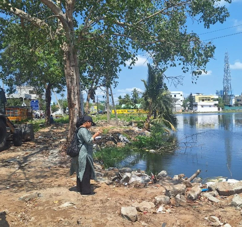 Field survey team assessing flood-prone waterbody and drainage conditions in Machilipatnam